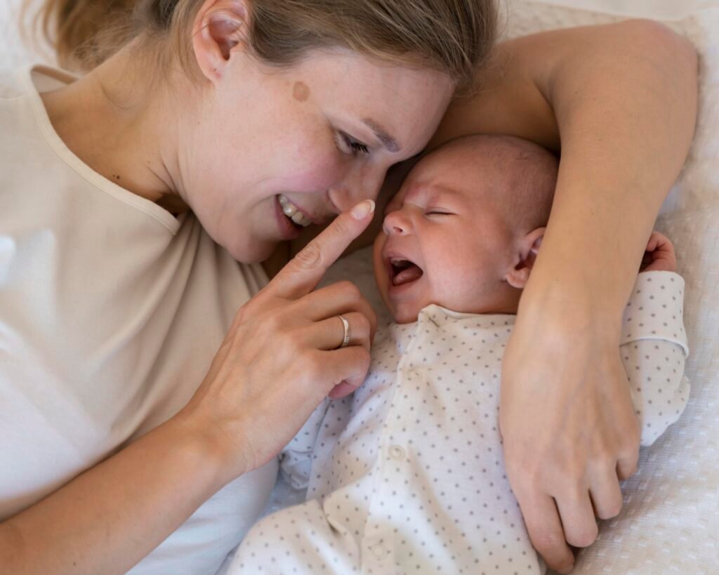 overstimulated baby being soothed by mother